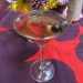 A Wittier Comeback cocktail, which features an olive and a cherry as garnish.