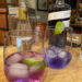 Two glasses of Empress gin: one is the original indigo color, while the other has lightened with the addition of tonic.